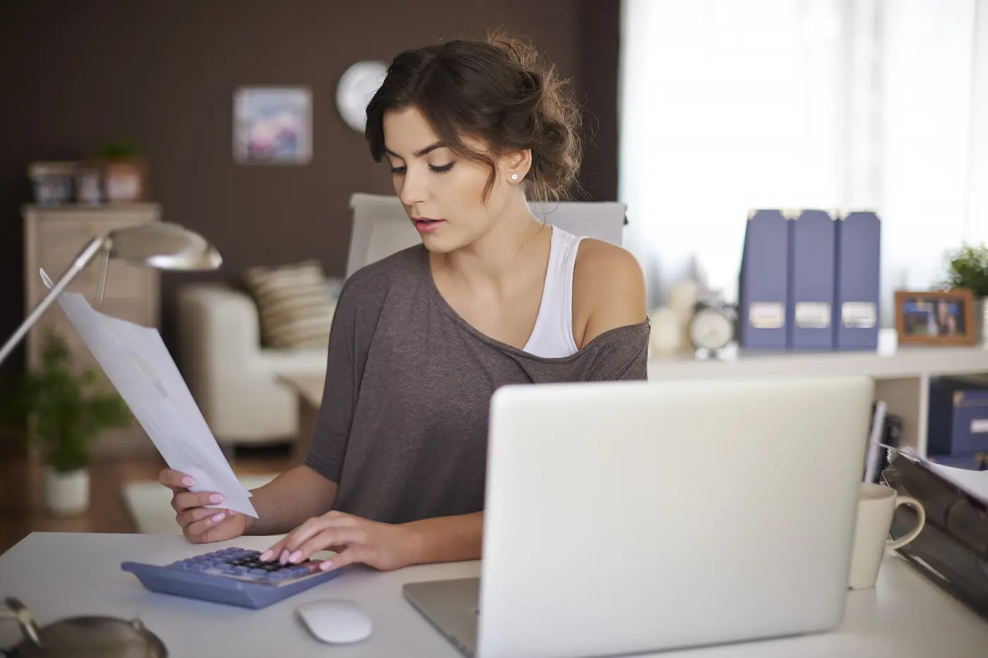 Business owner reviewing a website cost in Nepal quote on a laptop