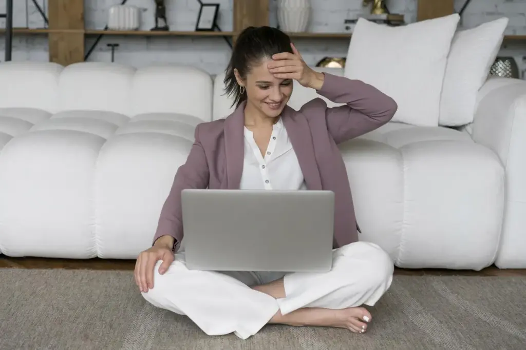 Woman looking frustrated at her laptop, wondering why is my website slow
